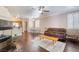 Open-concept living space with hardwood floors, fireplace, and seamless flow to the dining area and kitchen at 1661 Warrenville St, Las Vegas, NV 89117
