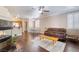 Open-concept living space with hardwood floors, fireplace, and seamless flow to the dining area and kitchen at 1661 Warrenville St, Las Vegas, NV 89117