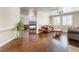Open-concept living room with hardwood floors and a cozy fireplace feature at 1661 Warrenville St, Las Vegas, NV 89117