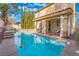 Backyard features a private pool and spa with a covered patio at 1661 Warrenville St, Las Vegas, NV 89117