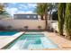 Relaxing backyard spa featuring tile accents, set amidst a private outdoor oasis at 1661 Warrenville St, Las Vegas, NV 89117