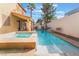 Backyard features a private pool and spa with lush landscaping at 1661 Warrenville St, Las Vegas, NV 89117