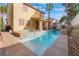 Backyard features a private pool and spa with an attached covered patio at 1661 Warrenville St, Las Vegas, NV 89117