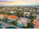 Panoramic aerial perspective of a residential area featuring well-maintained homes and tree-lined streets with city views at 2221 Glenbrook Way, Las Vegas, NV 89117