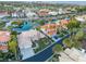 Aerial view of residential area featuring a lake with beautiful homes and lush landscaping at 2221 Glenbrook Way, Las Vegas, NV 89117