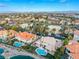Drone view showcasing a lakefront community with well-manicured lawns and beautiful landscape at 2221 Glenbrook Way, Las Vegas, NV 89117
