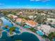 Aerial view showcasing houses within a community featuring lush landscaping, community lakes, and city views at 2221 Glenbrook Way, Las Vegas, NV 89117