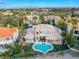 Expansive home with a private pool and covered patio, set amidst lush landscaping at 2221 Glenbrook Way, Las Vegas, NV 89117