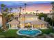 Stunning backyard featuring a pool, spa, and lush landscaping, perfect for outdoor entertaining and relaxing in luxury at 2221 Glenbrook Way, Las Vegas, NV 89117