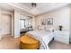 Nicely decorated bedroom with a neutral color scheme, mirrored closet doors, ceiling fan, and ensuite access at 2221 Glenbrook Way, Las Vegas, NV 89117