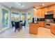 Kitchen and breakfast nook with stainless steel appliances, granite countertops, and lots of natural light at 2221 Glenbrook Way, Las Vegas, NV 89117