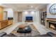Large living room with fireplace, built-in shelves, and a view of the city lights at 2221 Glenbrook Way, Las Vegas, NV 89117