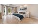 Serene main bedroom with a fireplace, tray ceiling, and access to a private balcony, creating a tranquil retreat at 2221 Glenbrook Way, Las Vegas, NV 89117