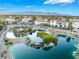 Picturesque community pond with serene water features and beautiful homes in the backdrop at 2221 Glenbrook Way, Las Vegas, NV 89117