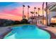 Sparkling pool and spa with palm trees and views of the beautiful sunset at 2221 Glenbrook Way, Las Vegas, NV 89117