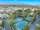 Aerial view of community tennis courts, lush greenery, and well-maintained surroundings at 2221 Glenbrook Way, Las Vegas, NV 89117