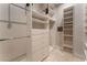 A well-organized walk-in closet with ample shelving, drawers, and hanging space for efficient storage solutions at 2221 Glenbrook Way, Las Vegas, NV 89117