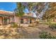 Backyard with patio, plants, trees, and well-maintained landscape at 2611 Laguna Shores Ln, Las Vegas, NV 89121