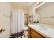 Well-maintained bathroom with tiled floors, shower, and a vanity with sink at 2611 Laguna Shores Ln, Las Vegas, NV 89121