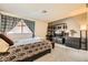 Comfortable bedroom featuring a window, stylish decor, and carpet flooring at 2611 Laguna Shores Ln, Las Vegas, NV 89121