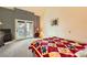 Well-lit bedroom features a striped accent wall and patio access at 2611 Laguna Shores Ln, Las Vegas, NV 89121
