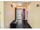 Inviting entryway featuring tiled floors, bench seating, decorative lighting, and an added security door at 2611 Laguna Shores Ln, Las Vegas, NV 89121