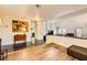 Open concept floor plan with hardwood floors, lighting fixtures and a fireplace at 2611 Laguna Shores Ln, Las Vegas, NV 89121