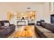 Open concept living area showcasing the wood flooring and light fixtures at 2611 Laguna Shores Ln, Las Vegas, NV 89121