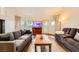 Large living room with wood flooring, a fireplace, and an entertainment center at 2611 Laguna Shores Ln, Las Vegas, NV 89121