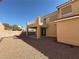 Backyard featuring a covered patio, balcony, gravel ground cover, and block wall at 2628 Park Hyatt Ave, North Las Vegas, NV 89081