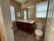 Bathroom featuring double sinks, a toilet, and tile flooring at 2628 Park Hyatt Ave, North Las Vegas, NV 89081