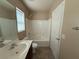 Cozy bathroom featuring a tub/shower, neutral wall paint, vanity sink, and tiled flooring at 2628 Park Hyatt Ave, North Las Vegas, NV 89081