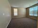 Bedroom featuring a large window, neutral wall color and carpeting, and recessed lighting at 2628 Park Hyatt Ave, North Las Vegas, NV 89081