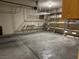 Spacious garage featuring overhead storage rack and metal shelving units for organization and convenience at 2628 Park Hyatt Ave, North Las Vegas, NV 89081