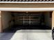 Spacious garage with built-in shelving units and ample room for parking and storage solutions at 2628 Park Hyatt Ave, North Las Vegas, NV 89081