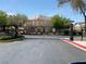 Neighborhood entrance with gates, landscaping, a speed limit sign, and a well-maintained road at 2628 Park Hyatt Ave, North Las Vegas, NV 89081