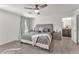 Comfortable bedroom featuring plush carpeting, a ceiling fan, and a cozy gray color scheme at 2682 Weathered Copper Ave, North Las Vegas, NV 89086