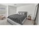 Bedroom with a plush bed, sliding door closet, and neutral decor at 2682 Weathered Copper Ave, North Las Vegas, NV 89086