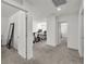 Upstairs hallway leading to a work area with desks and an exercise bike at 2682 Weathered Copper Ave, North Las Vegas, NV 89086