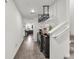 Hallway featuring hard surface flooring, beverage center, and view into kitchen area at 2682 Weathered Copper Ave, North Las Vegas, NV 89086