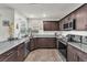 Kitchen with stainless steel appliances, granite countertops, and hard surface flooring at 2682 Weathered Copper Ave, North Las Vegas, NV 89086