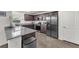 Kitchen featuring stainless steel appliances, hard surface flooring, and breakfast bar at 2682 Weathered Copper Ave, North Las Vegas, NV 89086