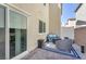 Private patio has stone pavers and outdoor seating, perfect for relaxing and entertaining at 2682 Weathered Copper Ave, North Las Vegas, NV 89086