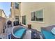 This outdoor patio features modern furniture and a gas grill, perfect for backyard barbecues at 2682 Weathered Copper Ave, North Las Vegas, NV 89086