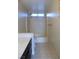 Well-lit bathroom featuring a shower-tub combo with modern fixtures at 2711 Sesame Dr, Las Vegas, NV 89142