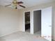 Bedroom with ceiling fan, bathroom and closet access at 2711 Sesame Dr, Las Vegas, NV 89142