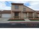 Charming two-story home featuring a red tile roof, a two-car garage, and a well-maintained front yard at 2711 Sesame Dr, Las Vegas, NV 89142