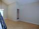 A spacious living room with laminate flooring, high ceilings, and a chandelier at 2711 Sesame Dr, Las Vegas, NV 89142