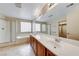 Bright bathroom featuring a double sink vanity, glass block window, separate shower, and soaking tub at 2752 Drummossie Dr, Henderson, NV 89044