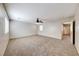 Large carpeted bedroom features a ceiling fan, neutral paint, and natural light at 2752 Drummossie Dr, Henderson, NV 89044